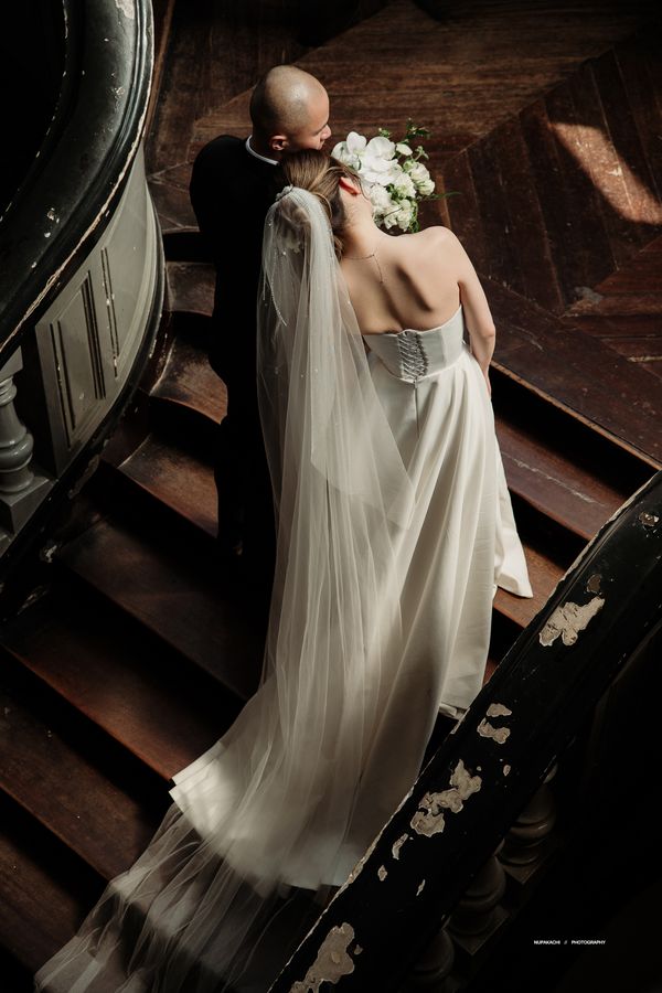 The Ha Long beaded two tier long wedding veil seen from above on a staircase