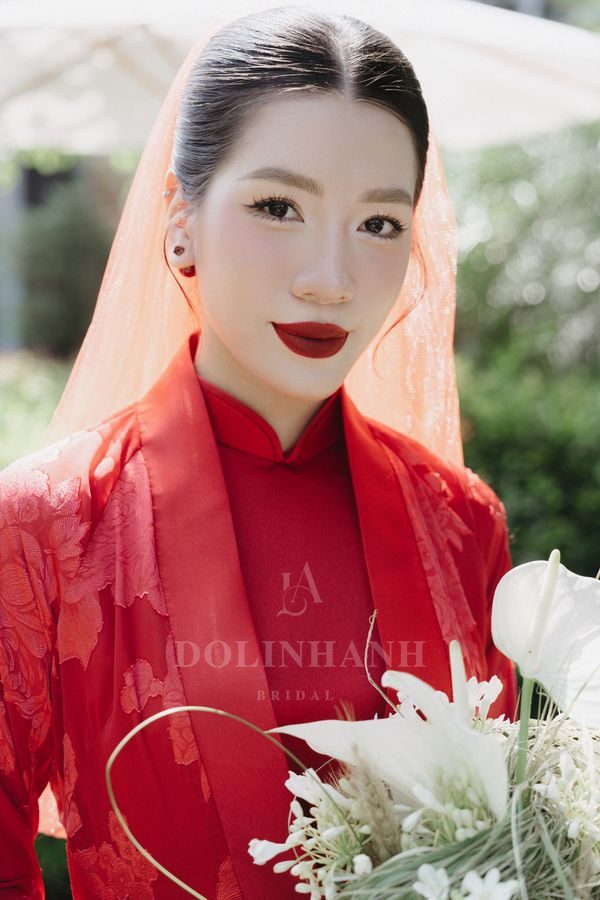 Red tulle veil worn with a red ao dai